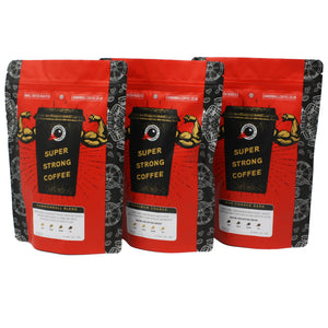 Full Bore Bundle - 3 x 250g bags of coffee, 1 of each of our 3 best-sellers. The bags are lined up next to each other, all feature a bright red background with a black coffee cup with biceps bursting out of it, and 'super strong coffee' written on the cup 