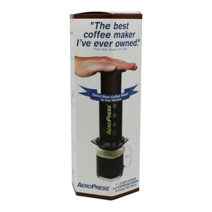 aeropress coffee maker in its box. features a picture of the a coffee being brewed using the press and the quote 'The best coffee maker I've ever owned' from a customer