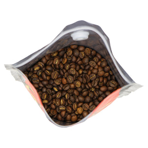 close-up of freshly roasted Cannonball Blend beans. It is a blend of medium roast brazilian arabica and rwandan robust beans, with a chocolate appearance.
